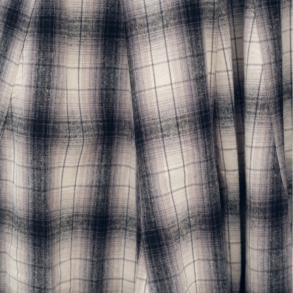 流蘇下擺剪接格紋裙