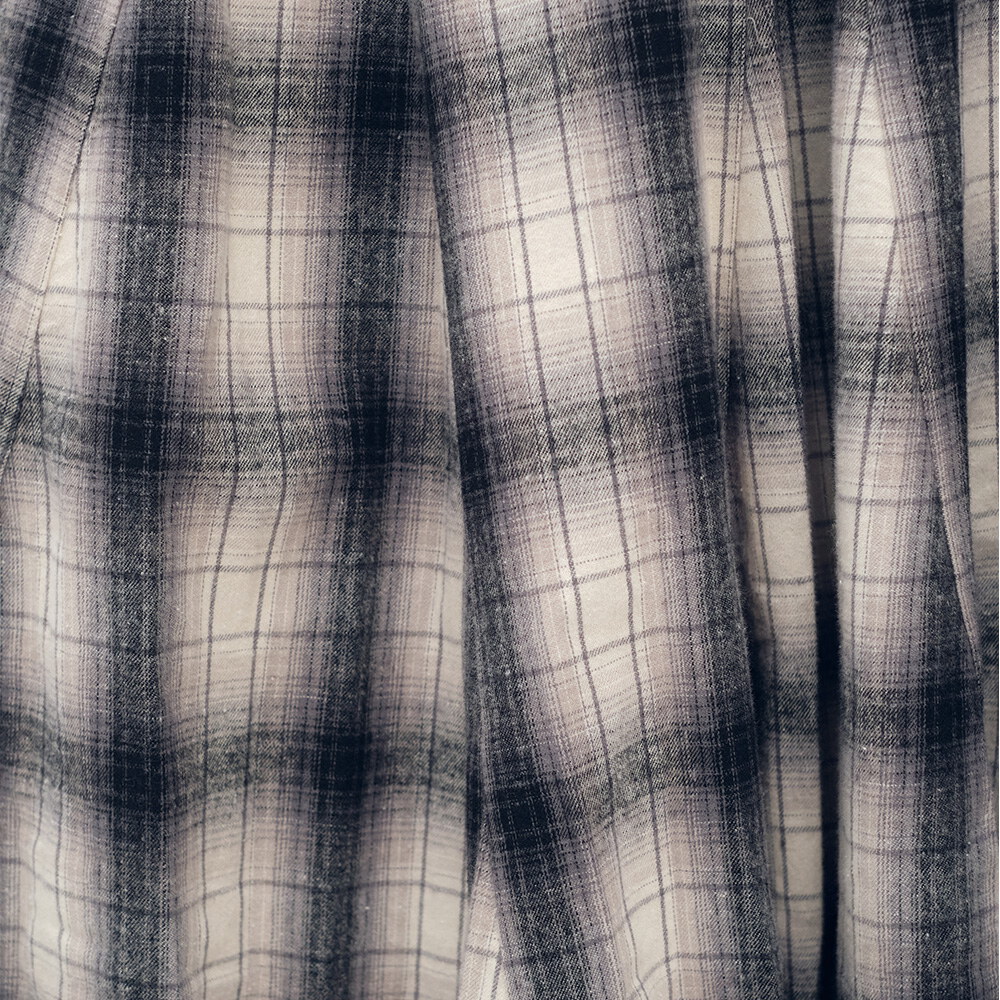 流蘇下擺剪接格紋裙